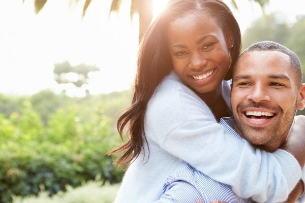 Happy couple embracing outdoors